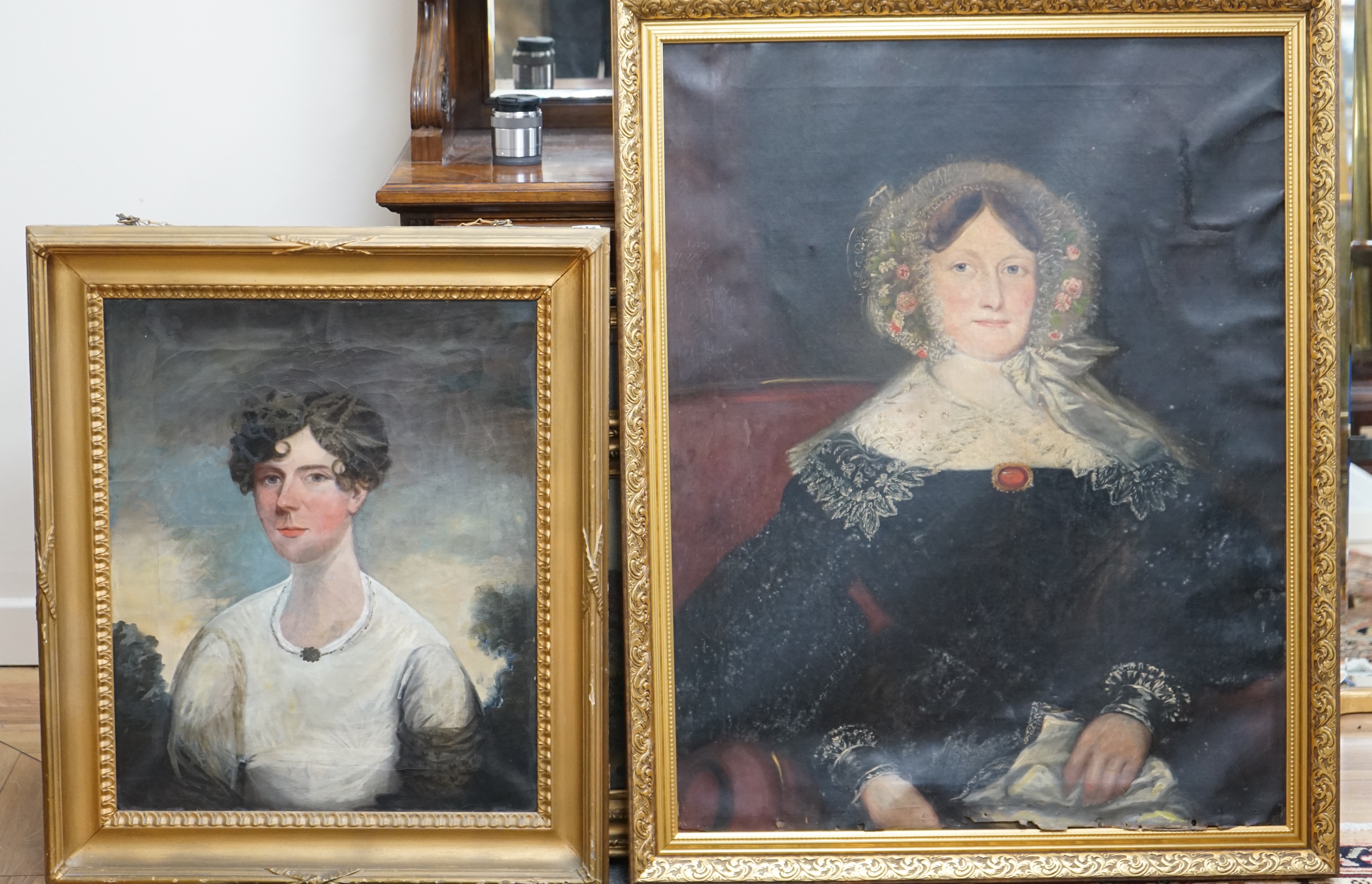 Two 19th century oils on canvas, comprising Regency naive School, portrait of a young lady and a mid 19th century School, portrait of a lady in mourning, largest 90 x 70cm. Condition - poor